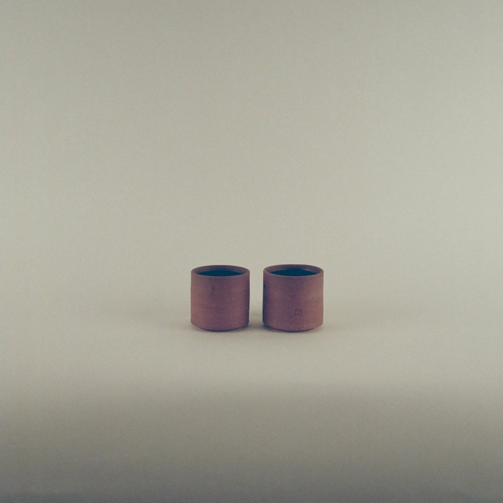 Red Cups with Black Glaze Interior